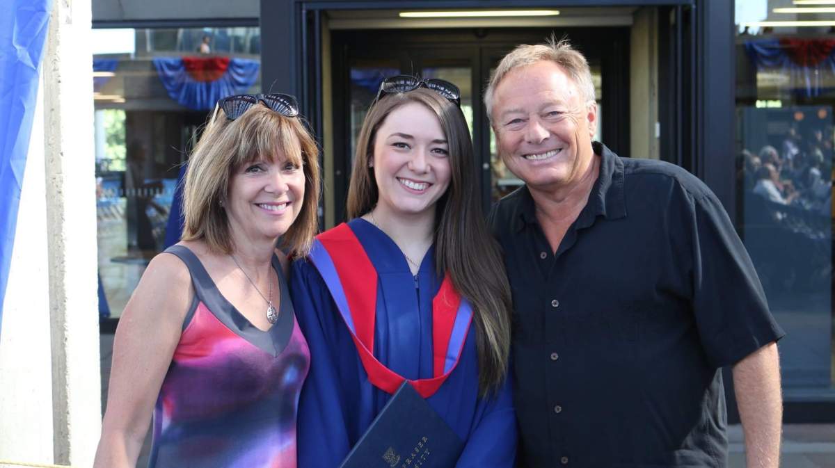 Deb and Roger with daughter Roxanne at her graduation.
