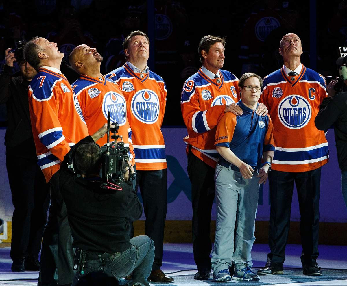 (From left) Former Oilers Paul Coffey, Grant Fuhr, Jari Kurri, Wayne Gretzky and Mark Messier along with longtime dressing room attendant Joey Moss watch as a banner is lowered during the closing ceremonies at Rexall Place on April 6, 2016.