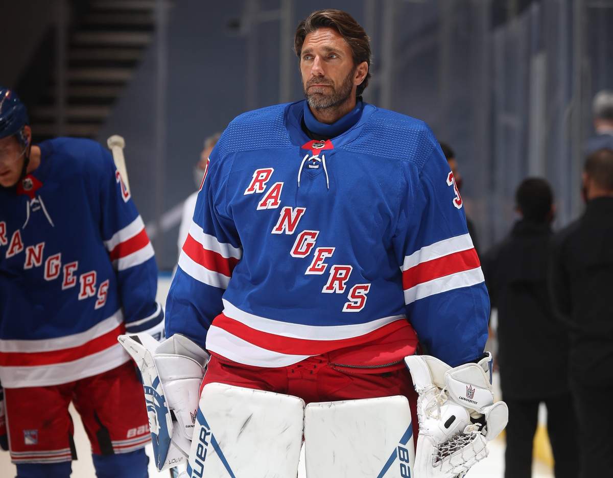 TORONTO, ONTARIO - AUGUST 04: Henrik Lundqvist #30 of the New York Rangers looks on after the ceremonial handshake after Game Three of the Eastern Conference Qualification Round prior to the 2020 NHL Stanley Cup Playoffs at Scotiabank Arena on August 04, 2020 in Toronto, Ontario. The Hurricanes defeated the Rangers 4-1 in this game to win the five-game series 3-0. 