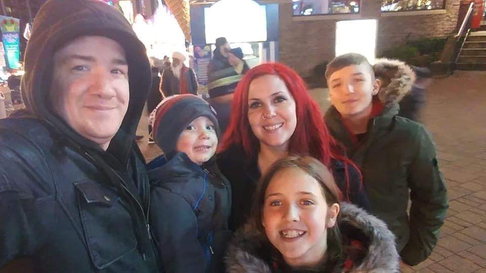 Cindy Devine with her husband Richard and children.