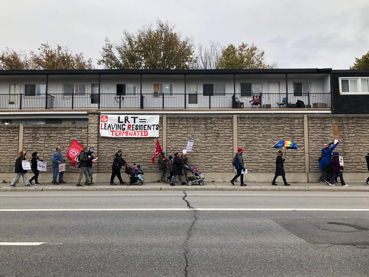 Manor Village residents march down Woodroffe Avenue alongside ACORN Ottawa and other housing advocates on Thursday, Oct. 29, 2020.