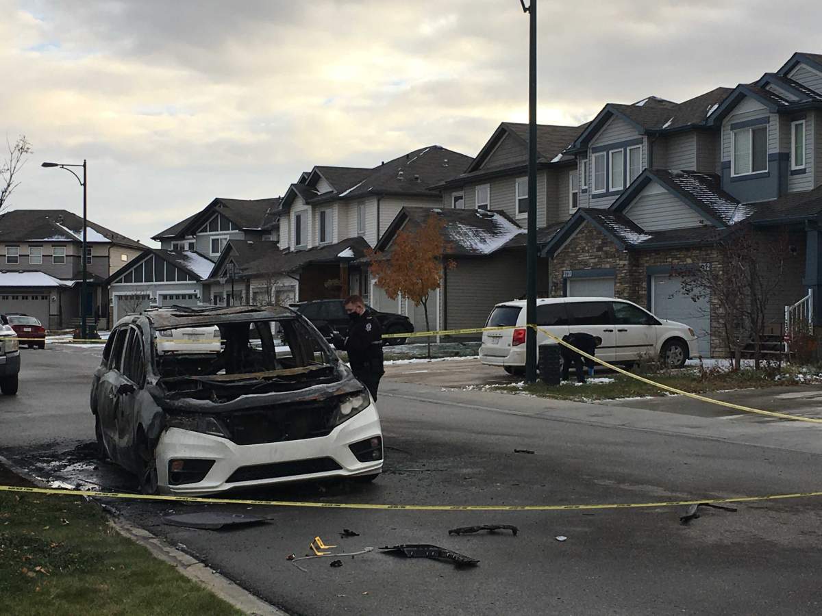 Edmonton police investigating a burnt vehicle near 37A Avenue and 9 Street in southeast Edmonton on Tuesday, October 20, 2020.
