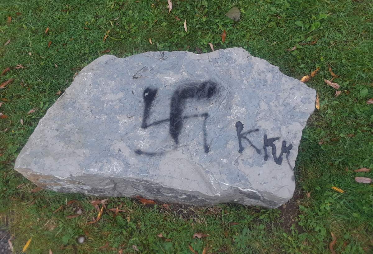 Nazi logo and "KKK" found on a rock in Harwood.