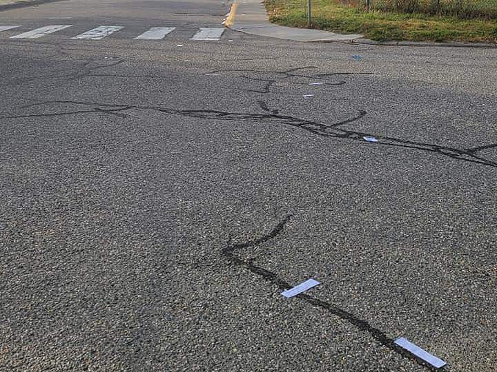 A photo showing clippings littered in front of a North Okanagan school.
