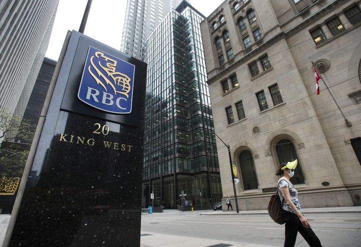 A person walks by the Royal Bank of Canada building on Bay Street during the COVID-19 Pandemic in Toronto on Wednesday, May 27, 2020. 