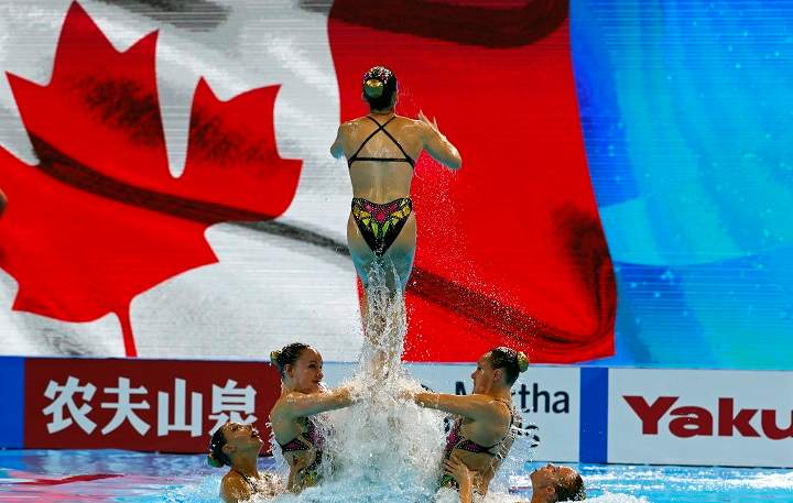 In this July 16, 2019 file photo, members of team Canada perform during  the FINA Swimming World Championships 2019 at the Yeomju gym in Gwangju, South Korea. Canada's artistic swim team has halted training at it's Montreal facility after complaints from athletes. Thursday, Oct. 1, 2020.