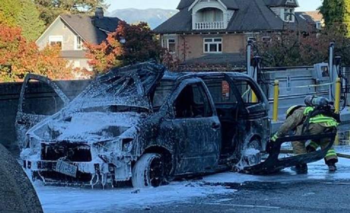 Fire crews extinguish a vehicle fire at Vancouver City Hall. 