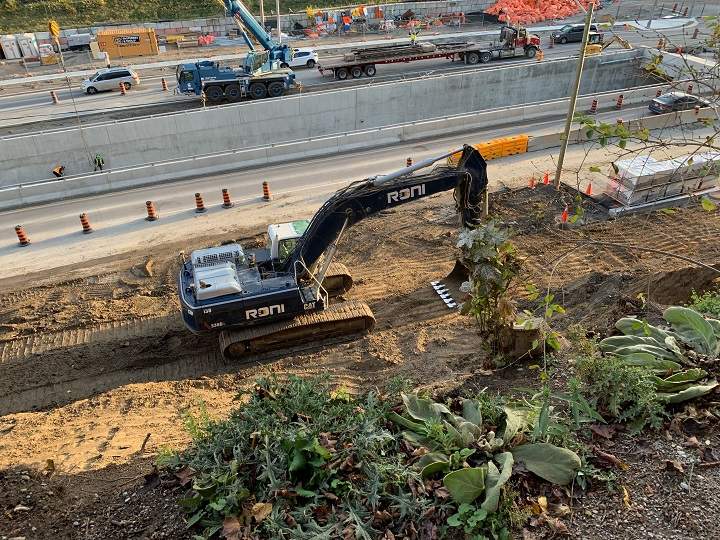 A photo of crews on scene working on the Eglinton Crosstown LRT following a partial ground collapse of earth.