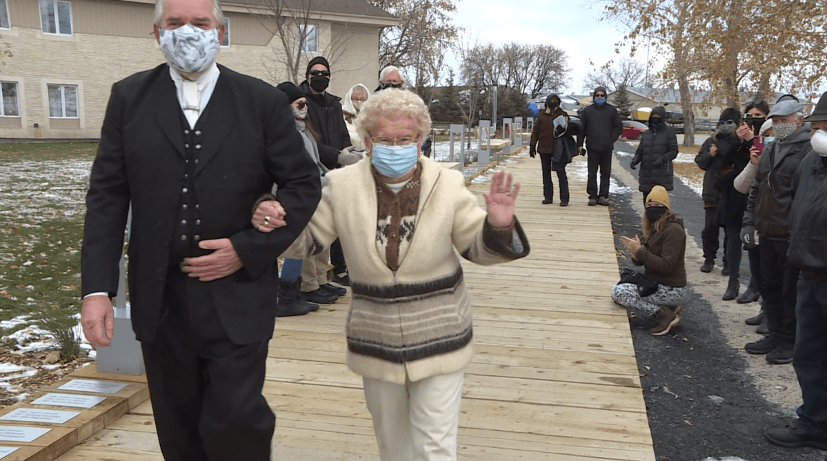 The 2020 Fjallkona, 98-year-old Anne Stevens, being escorted down the new Fjallkona walkway by Tim Arnason, a past president and lifetime member of the Icelandic Festival of Manitoba.