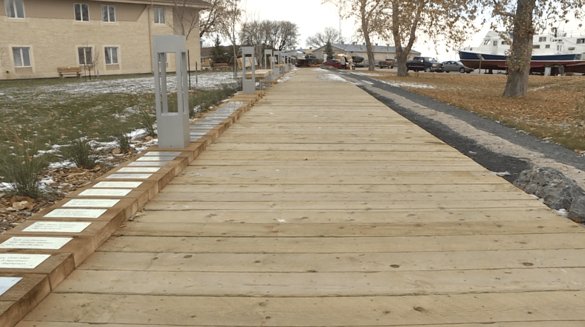 The Fjallkona walkway in Gimli, lined with plaques of former honournees.