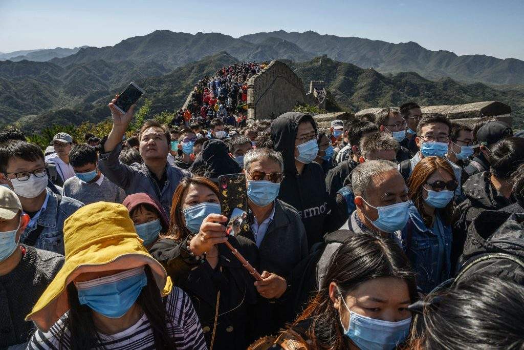 Chinese tourists crowd in a bottleneck as they move slowly on a section of the Great Wall at Badaling after tickets sold out during the ‘Golden Week’ holiday on Oct. 4, 2020 in Beijing, China.