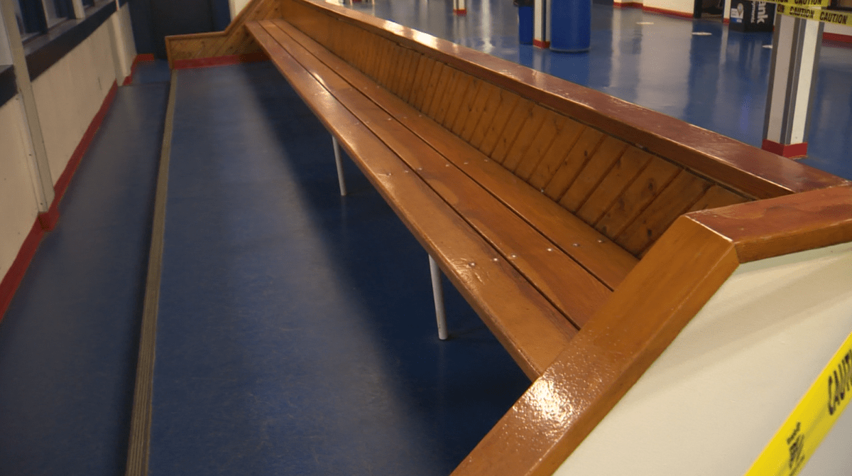 An empty lobby at Southdale Arena during a hockey practice Monday night, with seating benches taped off.