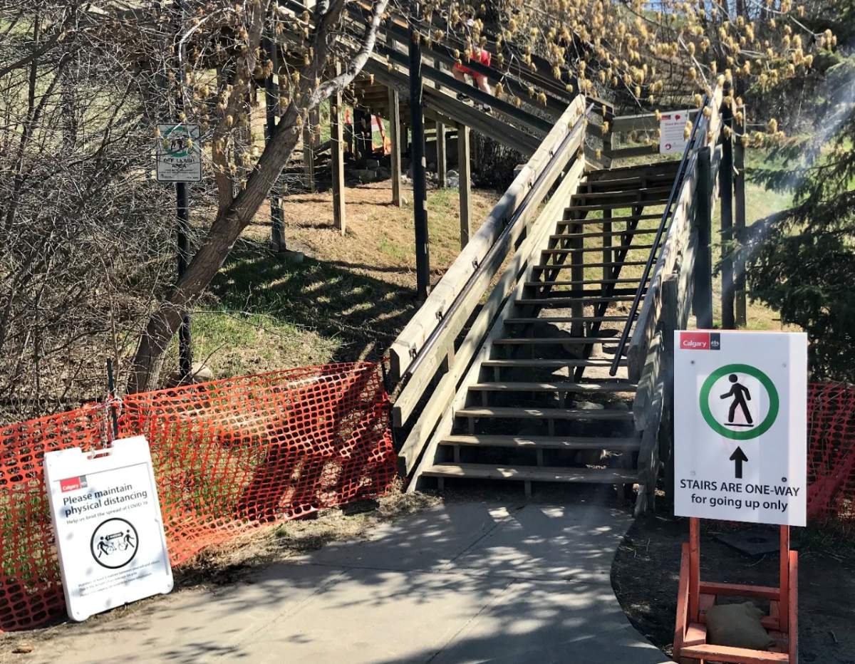 A sign in front of a public staircase in Calgary advises users that it’s a one-way route.