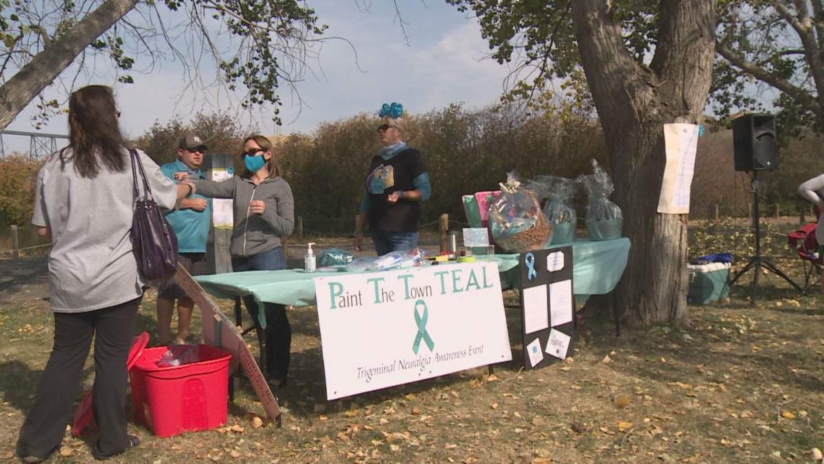 Participants of a scavenger hunt dressed in teal to raise awareness for trigeminal neuralgia on Sunday in Lethbridge.