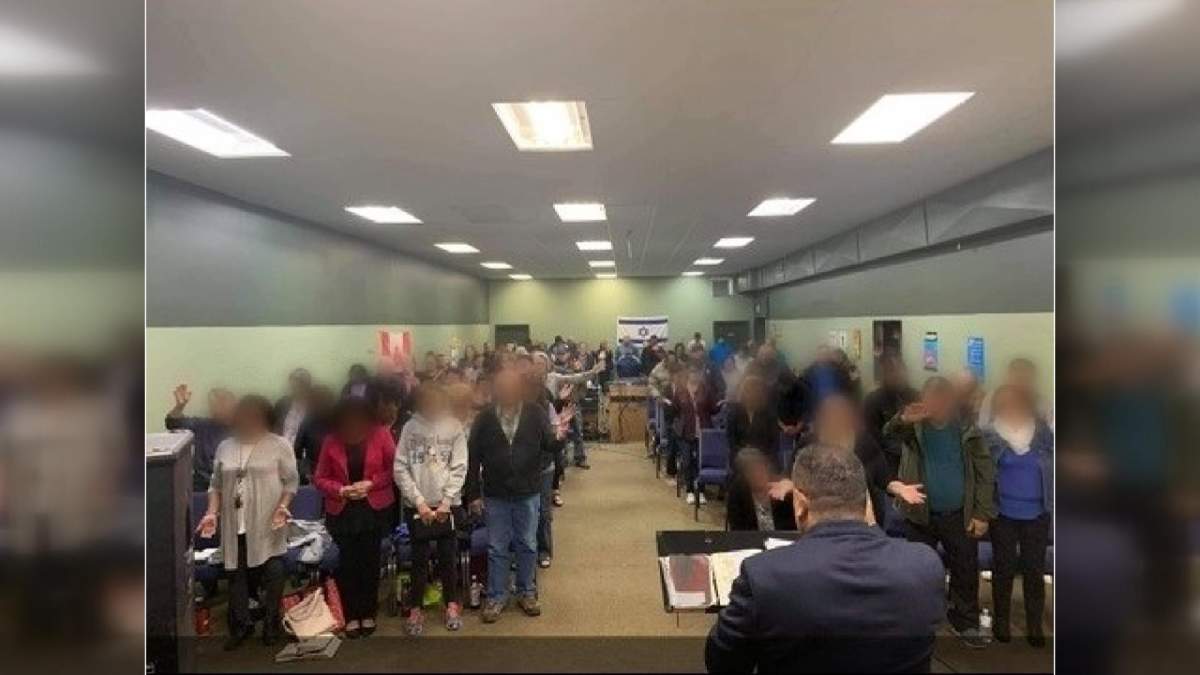 This photo from one of the Full Gospel Outreach events shows participants standing closer than 6-feet, and not wearing masks.