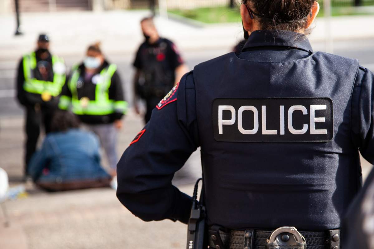 An officer is seen facing colleagues in this Calgary Police Service handout.
