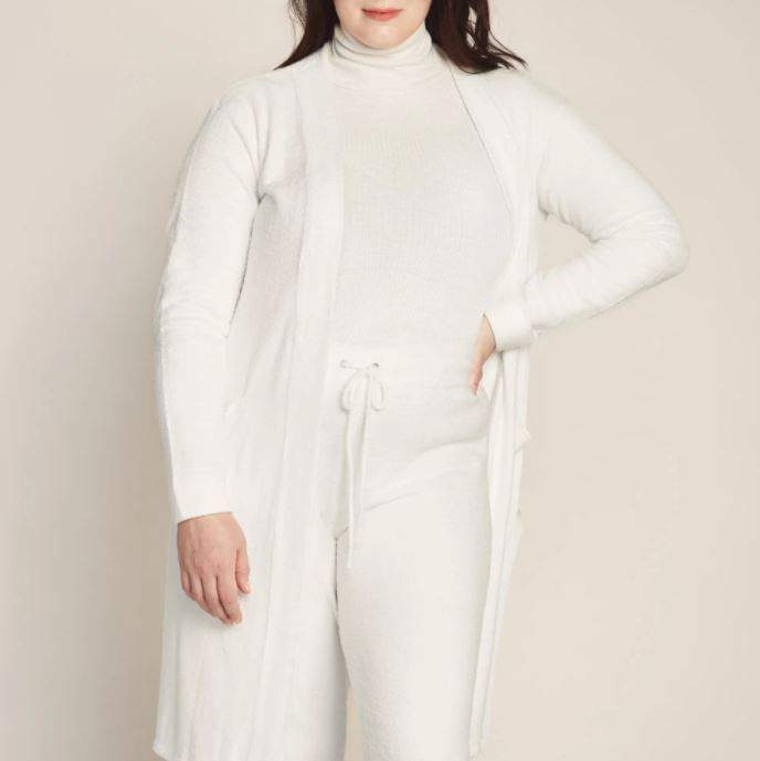 Cozzzy Lounge Cardigan, $80, available at Knix Forest Hill Candle, $30, available at Judes & Co.