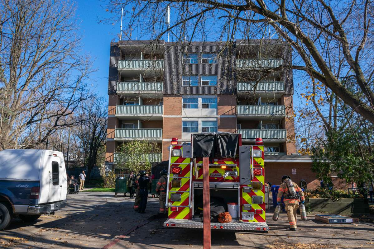 London Fire Department members at the scene of a fire on the third floor of 872 William St. in London, Ont., Nov. 12, 2020.
