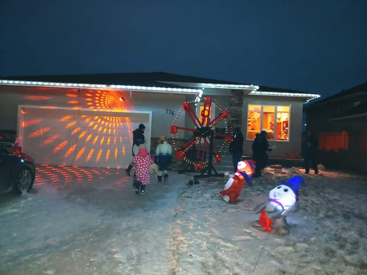 Trick-or-treaters approaching the nine-foot ferris wheel just after 8 p.m. on Halloween in Steinbach.