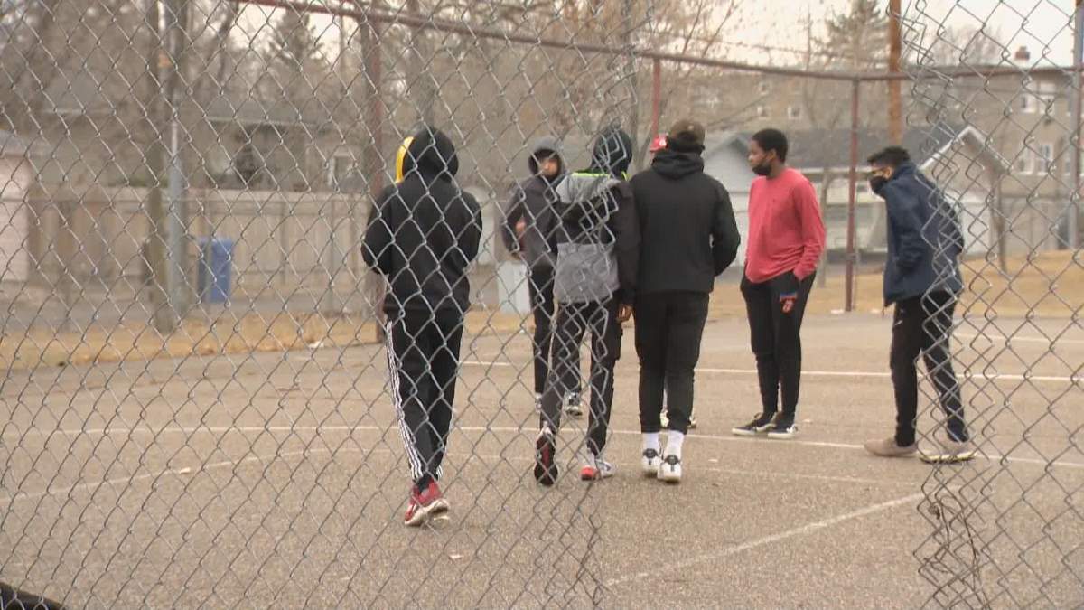 A tear in the court’s chain link fence makes for a unique entryway to the Lakeview court.