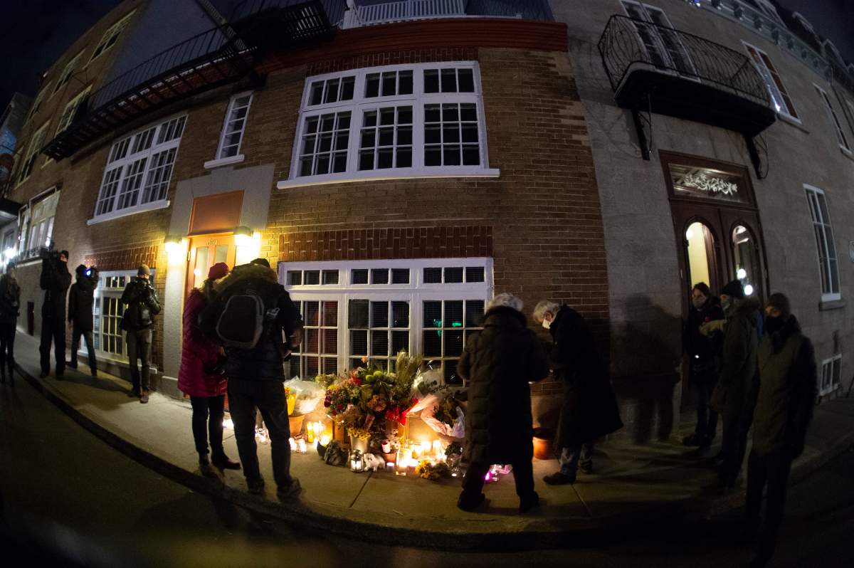 A vigil to honour Suzanne Clermont, who was stabbed to death on Halloween night by a man with a sword, Monday, Nov. 2, 2020  in Quebec City.