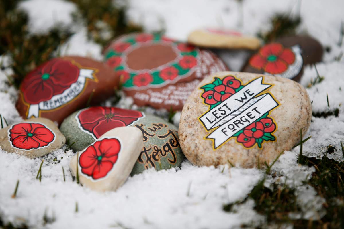 Some of Mungall’s painted stones are shown at the Brookside veterans cemetery in Winnipeg.