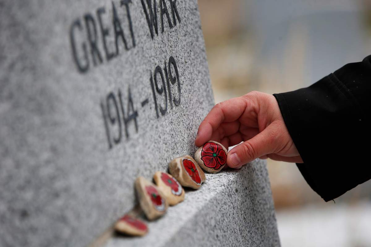 Mungall places her painted stones at the Brookside veterans cemetery in Winnipeg.