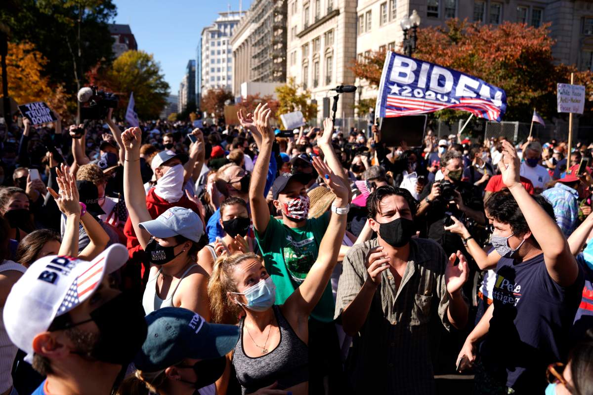 People react after major news organizations called the US 2020 presidential election for Joe Biden, defeating incumbent US President Donal​d J. Trump, near the White House in Washington, DC, USA, 07 November 2020. EPA/WILL OLIVER