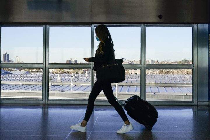 A traveler approaches the AirTrain to JKF International Airport Friday, Nov. 20, 2020, in New York. 