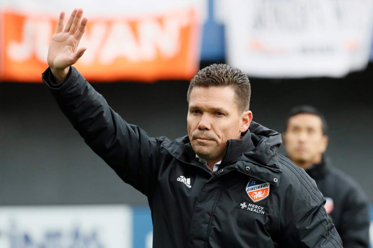 FC Cincinnati head coach Alan Koch waves to the crowd before an MLS soccer match against the Portland Timbers, Sunday, March 17, 2019, in Cincinnati. (AP Photo/John Minchillo).