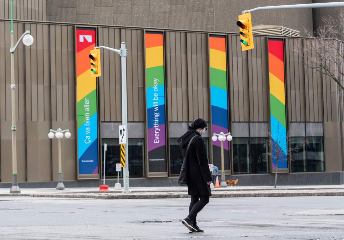 Digital screens on the side of the National Arts Centre display the message "Everything will be okay" and a rainbow, in the midst of the COVID-19 pandemic on Sunday, April 19, 2020.