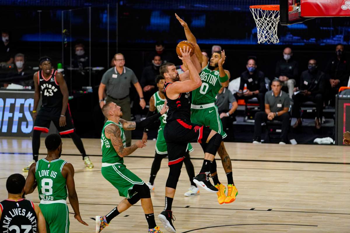 Toronto Raptors center Marc Gasol (33) shoots over Boston Celtics forward Jayson Tatum (0) during the first half of an NBA conference semifinal playoff basketball game Wednesday, Sept. 9, 2020, in Lake Buena Vista, Fla. 