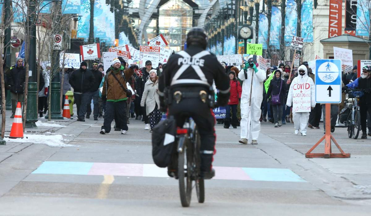 Hundreds of people gather in downtown Calgary to protest mandatory COVID-19 restrictions, Saturday, Nov. 28, 2020. 