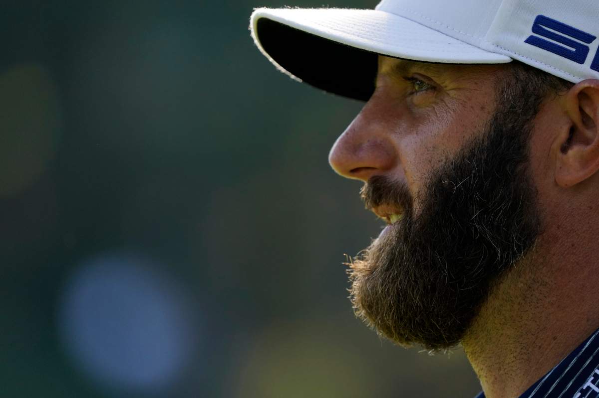 Dustin Johnson watches his tee shot on the 17th hole during the final round of the Masters golf tournament Sunday, Nov. 15, 2020, in Augusta, Ga.
