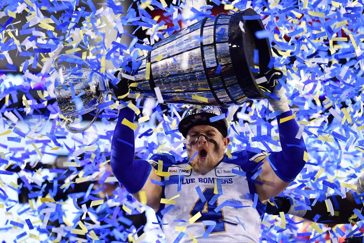 Winnipeg Blue Bombers' Adam Bighill celebrates winning the 107th Grey Cup against the Hamilton Tiger Cats in Calgary, Alta., Sunday, November 24, 2019.