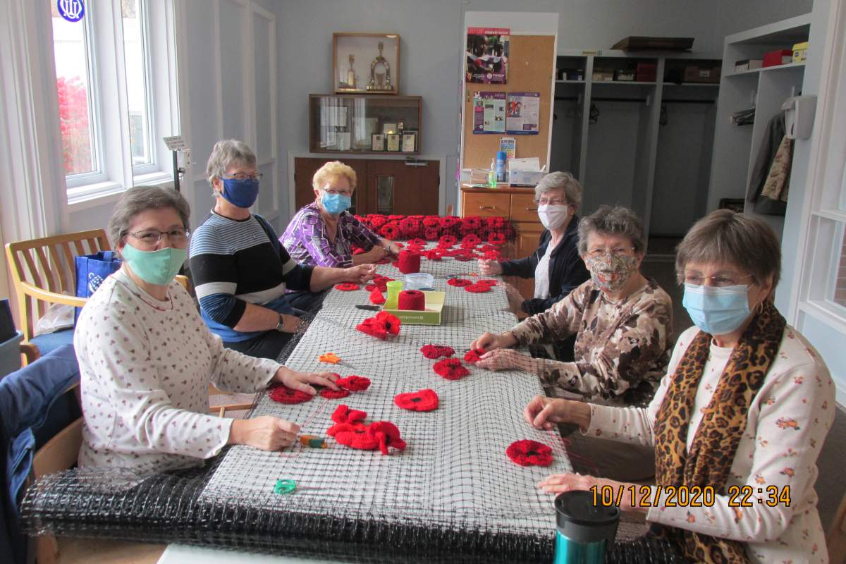 Oakwood Terrace Nursing Home volunteers work on Remembrance Day poppy display