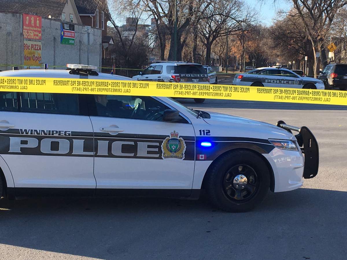 Winnipeg police at the scene on Isabel Street Monday afternoon.