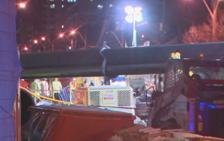 A crane tipped over near the future Mount Pleasant Eglinton-Crosstown station on Monday.