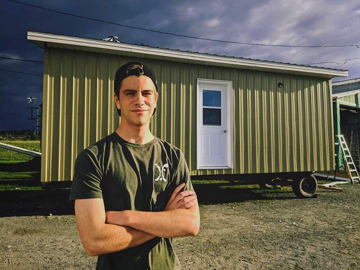 In this undated photo, Justin stands in front of his chicken coop in Saint-Georges-de-Beauce. 