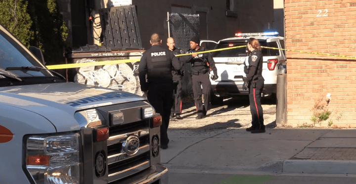 Police at the scene of a shooting in downtown Oshawa on Sunday.