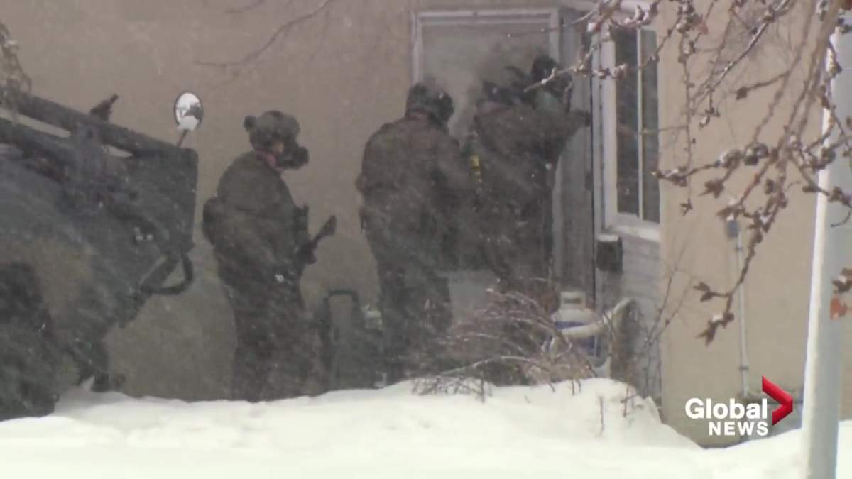 An Edmonton police tactical team at a housing complex near 38 Avenue and 78 Street in Mill Woods on Feb. 29, 2020.