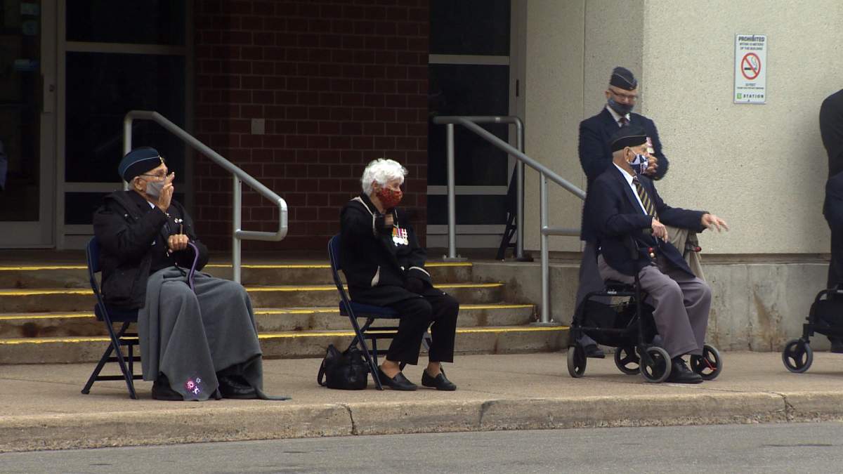 Winifred Rice and other veterans waited outside Saint John’s TD Station as residents drove by honking and waving to express thanks.