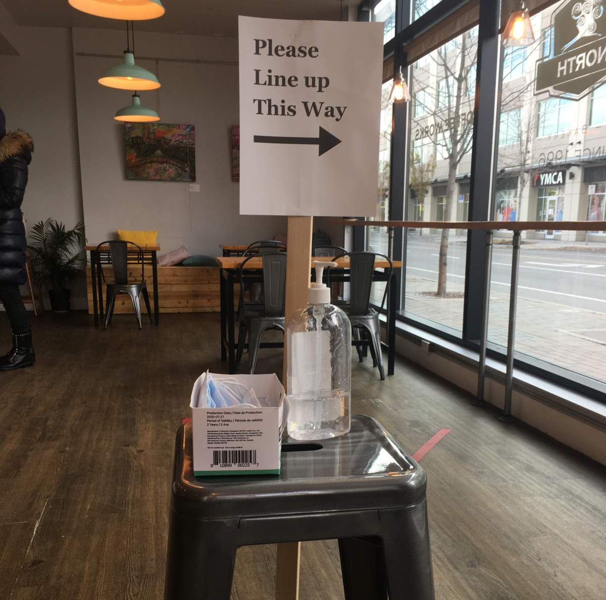 Masks and hand sanitizer offered to customers at the Bean Scene North coffee shop in Kelowna.
