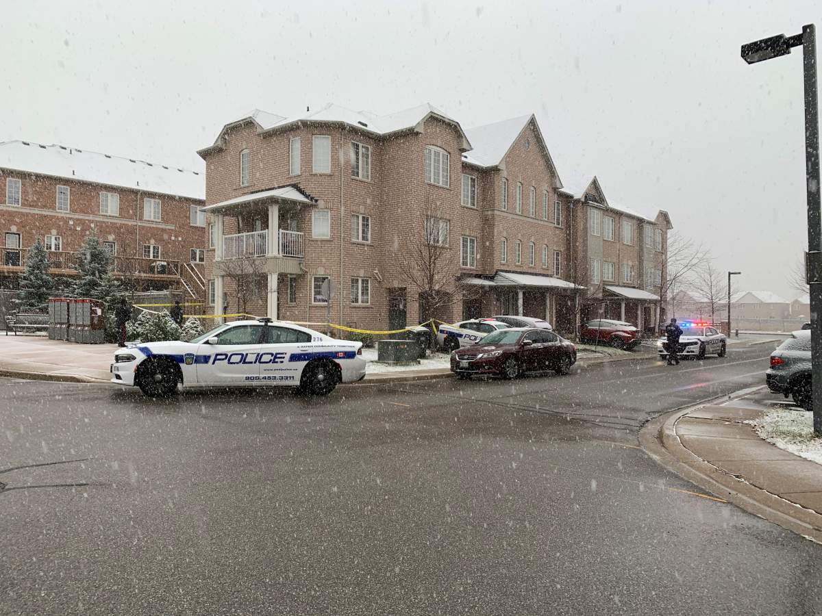Police at the scene of a stabbing in the area of James Potter Road and Berringer Grove.