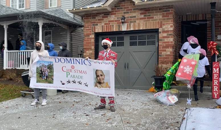 Elves delivering presents to Dominic DaCosta’s front porch.