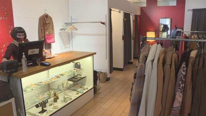 Yannick Vienne working at her Whyte Avenue business, Red Pony Consignment.