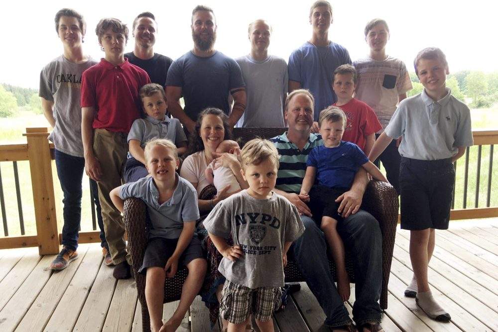 In a photo from May 30, 2018, the Schwandt family poses for a photo at their farm in Lakeview, Mich.