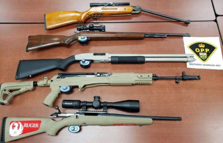 Officers executed a search warrant at a home on Tay Point Road at about 1:05 p.m. and seized a number of firearms, including a nine-millimetre  Glock 17 handgun and a large supply of ammunition.