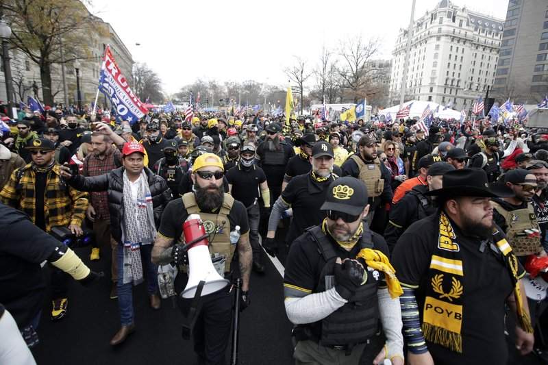 Supporters of President Donald Trump who are wearing attire associated with the Proud Boys attend a rally at Freedom Plaza, Saturday, Dec. 12, 2020, in Washington. 