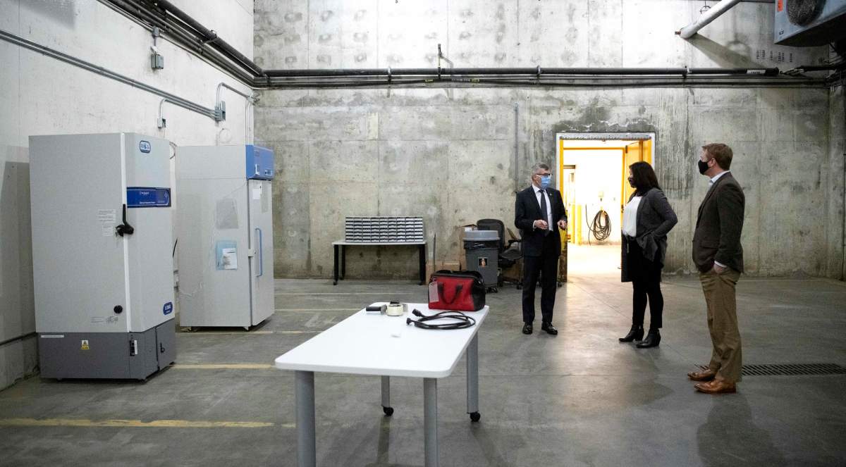 Kari Bergstrom, immunization business manager with Alberta Health, provides logistical highlights of the provincial COVID-19 cold storage vaccine depot to Health Minister Tyler Shandro and Deputy Minister of Health Paul Wynnyk on Monday, December 14, 2020.